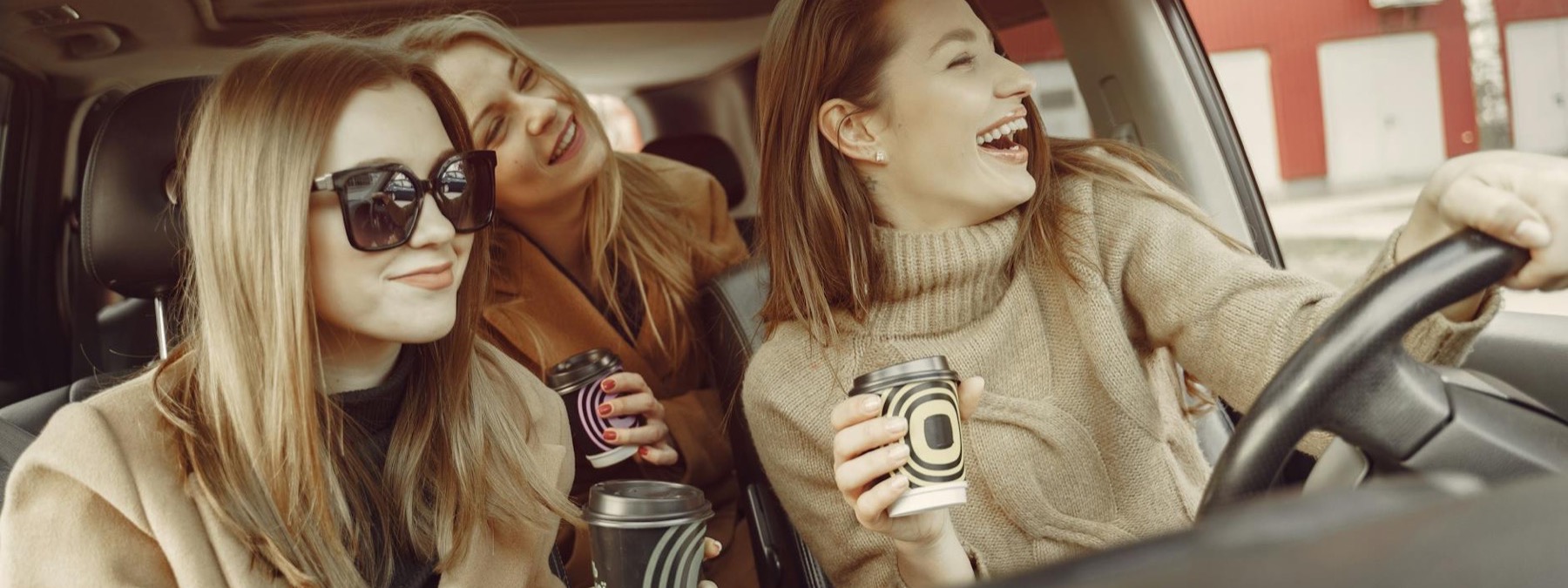 Smiling young travel therapists on a road trip between assignments